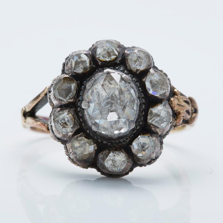 An 18K gold and silver ring with foil-backed rose-cut diamonds.