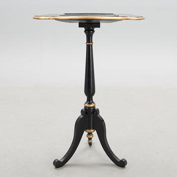 A Chinese tilt top chess table from the first half of the 20th century.