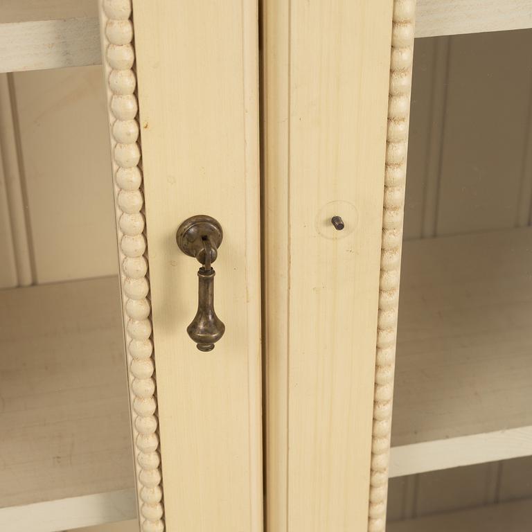 A pair of Gustavian style book cabinets, 21st century.