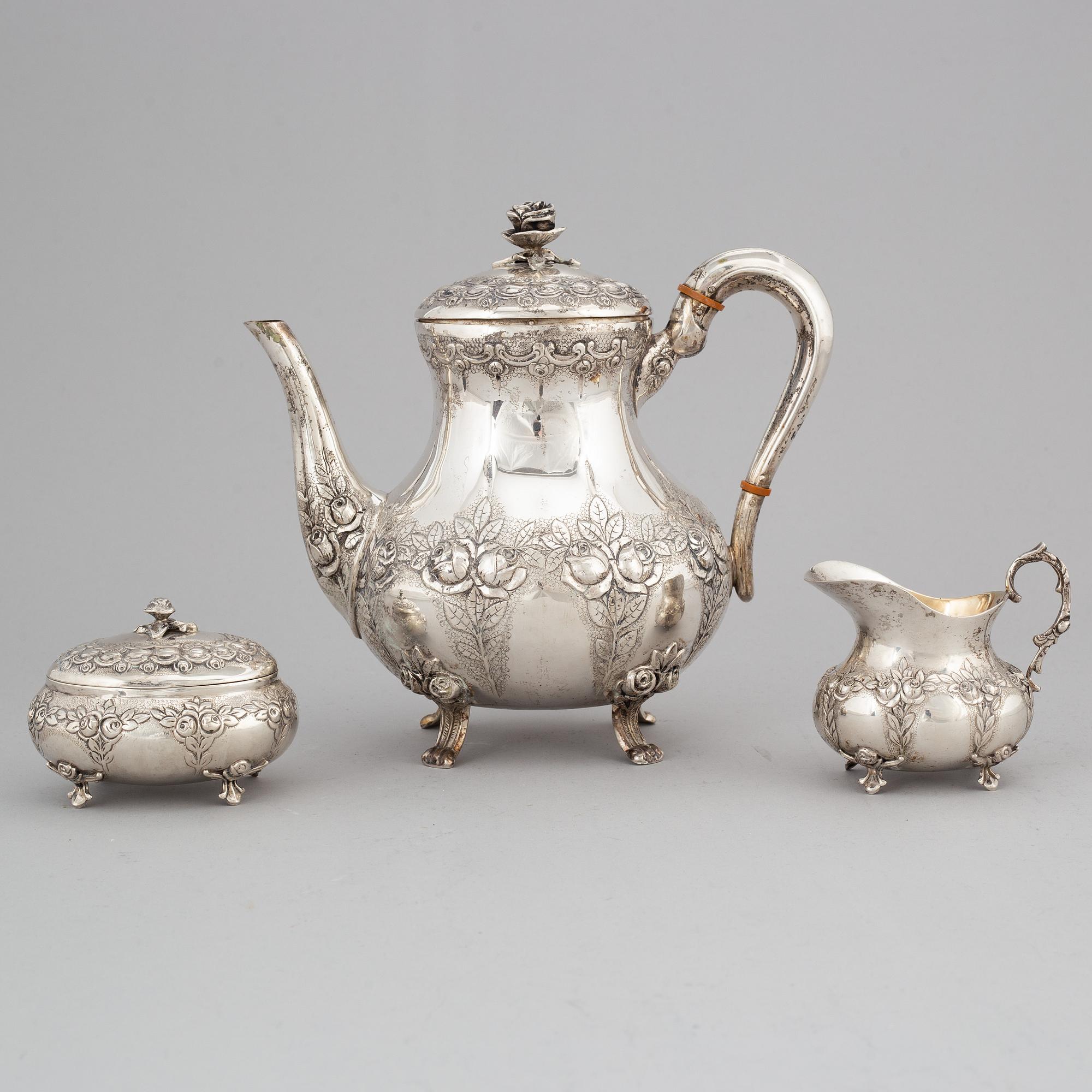 A silver coffee pot, creamer and sugar box. Swedish import mark.