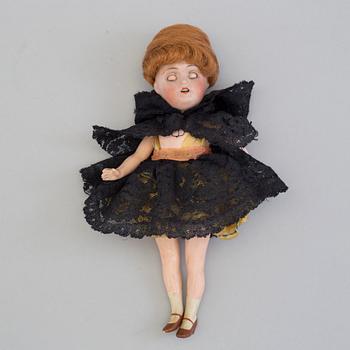 a german porcelain doll from the early 20th century.