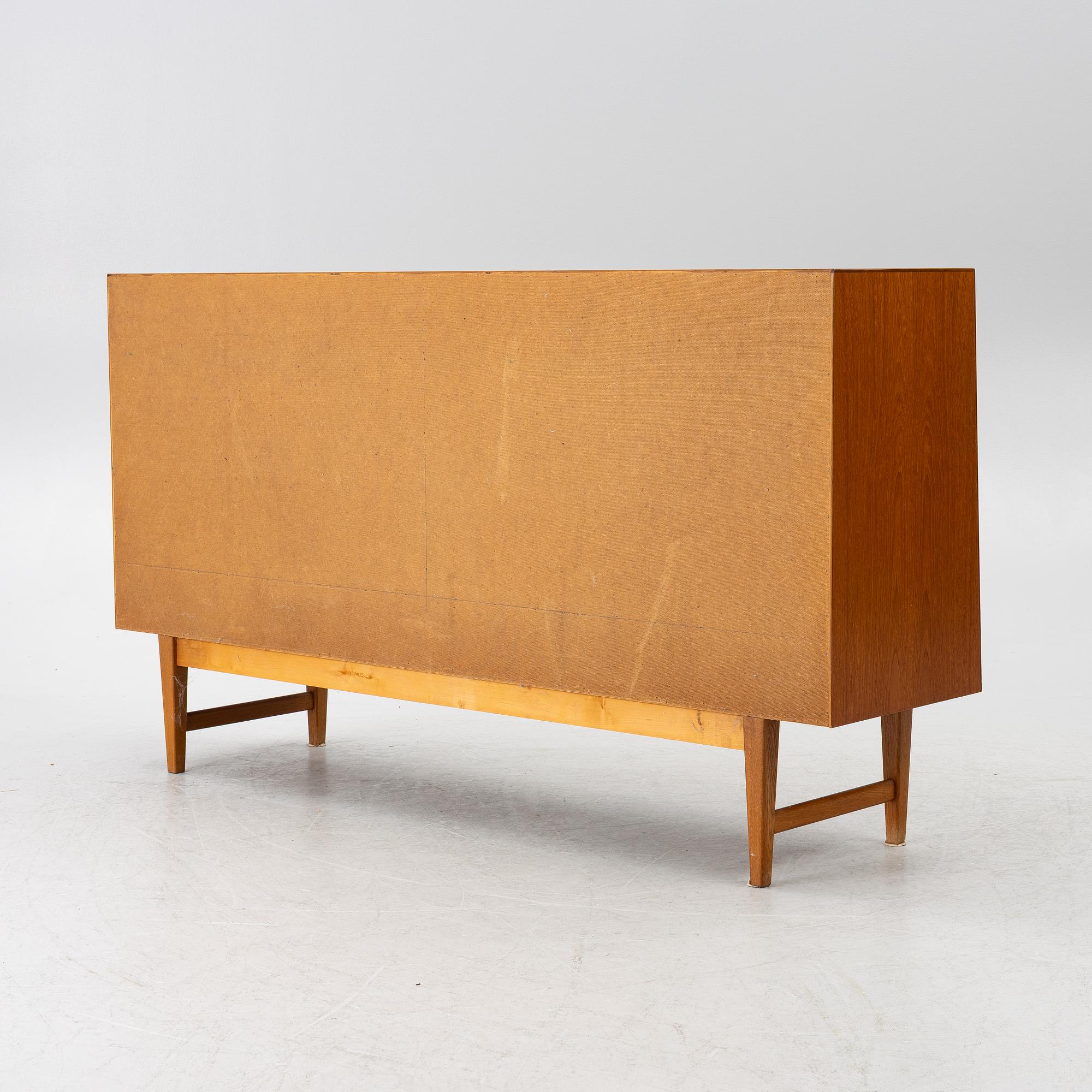 A mid20th century teak-veneered sideboard.