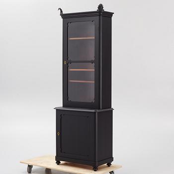 A display cabinet, late 20th Century.