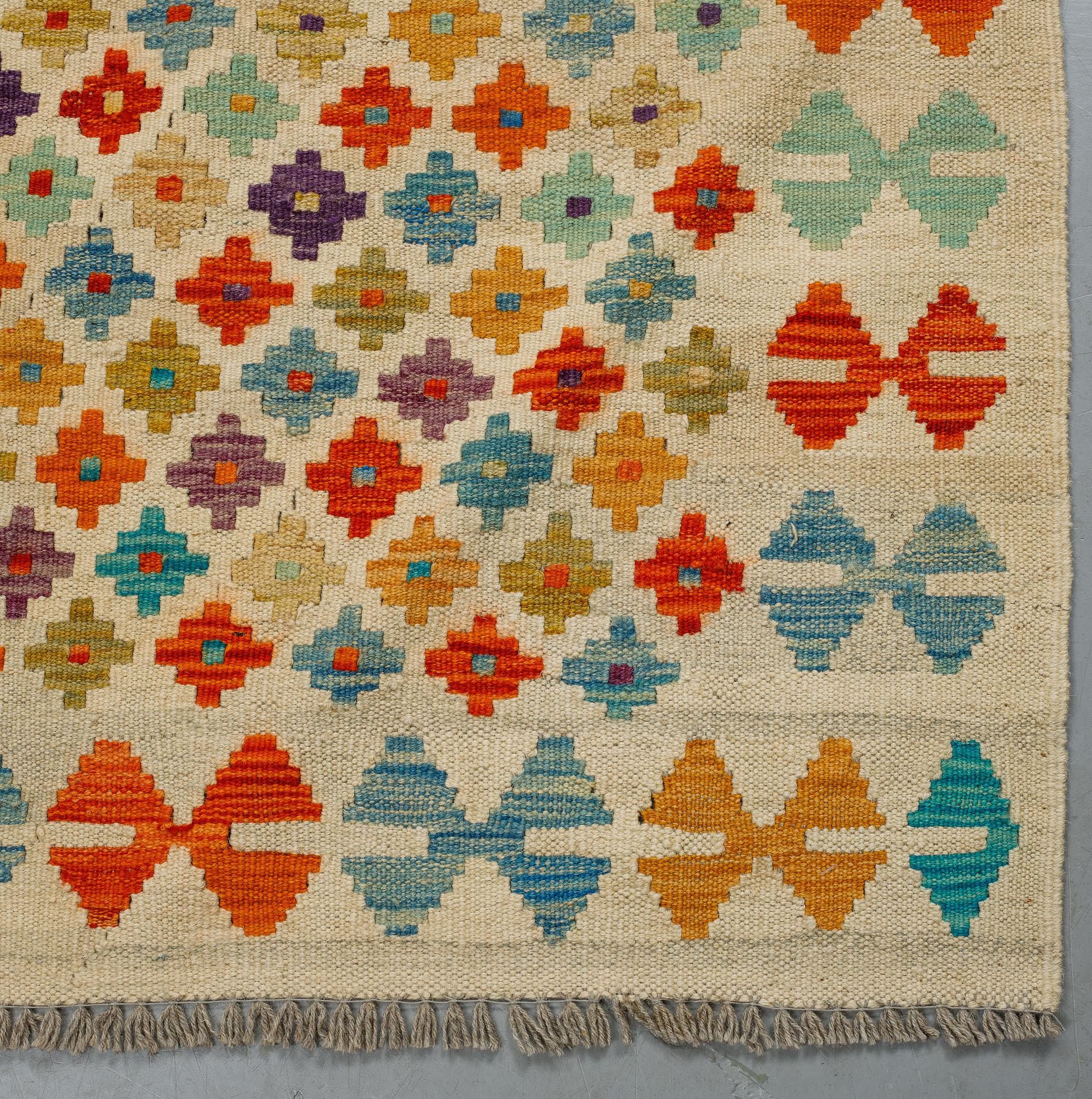 A carpet, kilim, ca 238 x 174 cm.