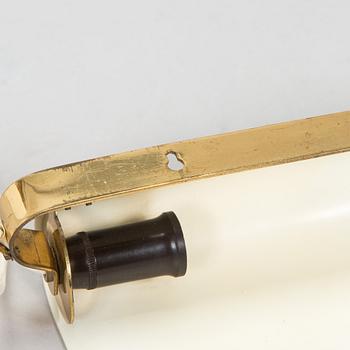 A pair of mid-20th century model 2317 wall lights by Valinte.