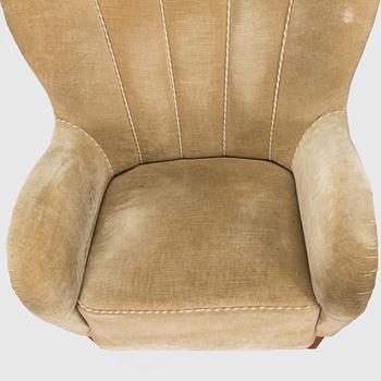 A pair of mid-20th century armchairs.