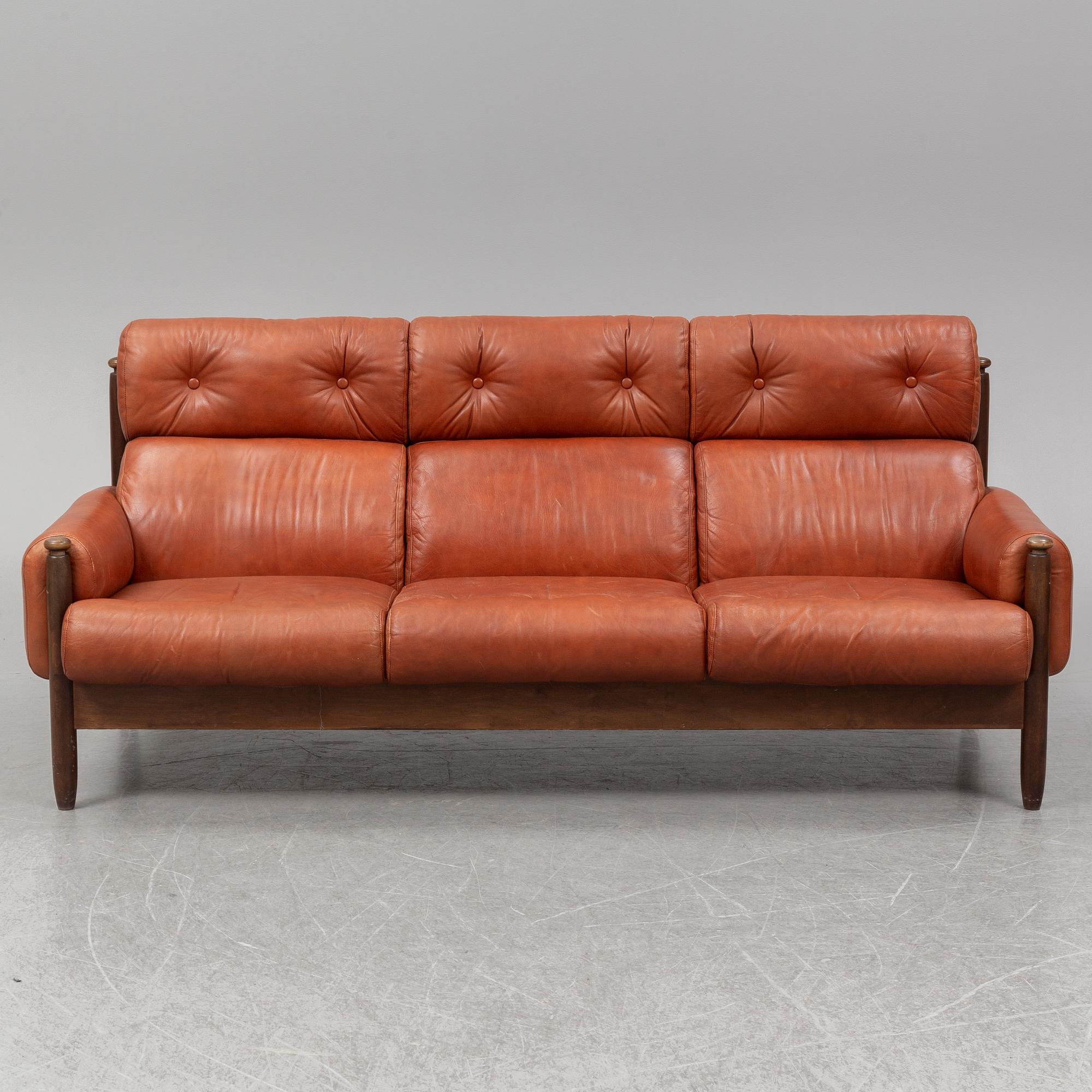 A 1960's/70's three-piece furniture suite.