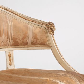 A late Gustavian carved and part-gilt open armchair, late 18th century.