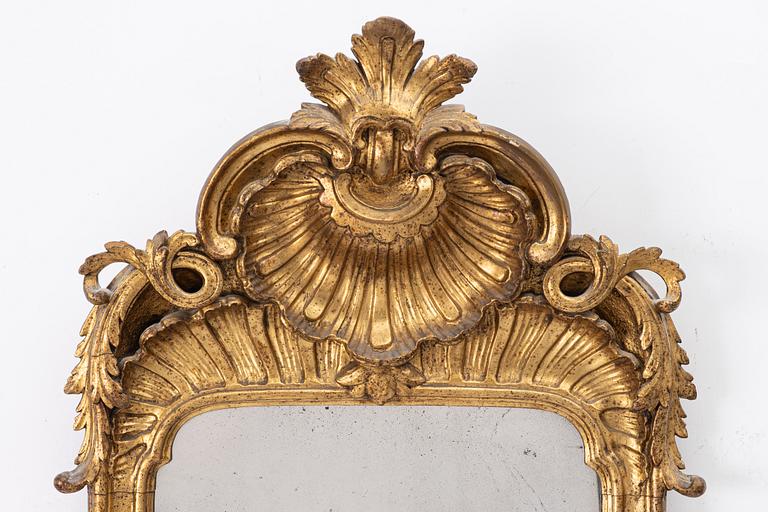 A Rococo mirror, 18th century.