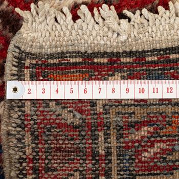 A runner carpet, North Western Iran, c. 317 x 107 cm.