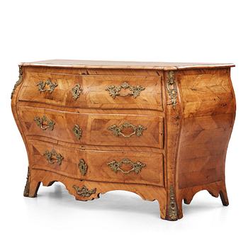 11. A brass-mounted and marquetry rococo commode, later part of the 18th century.