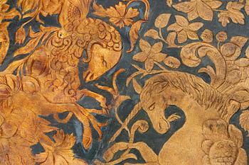 A 19th century wrought leather wallpaper, ca 388 x 97 cm.