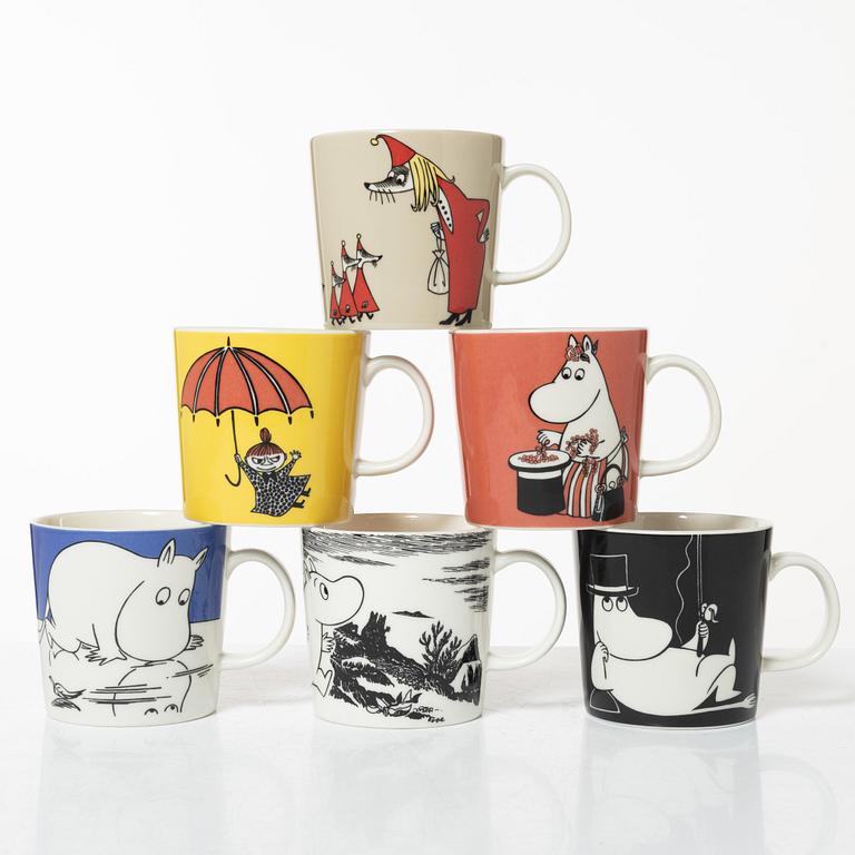 A set of 24 Moomin mugs, Arabia, Finland.