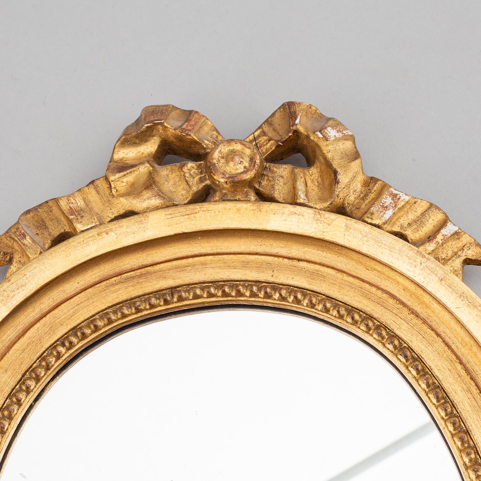 A mirror and a pair of mirror scones, gustavian style, 20th century.