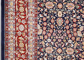 A signed Hereke carpet, ca 340 x 246 cm.