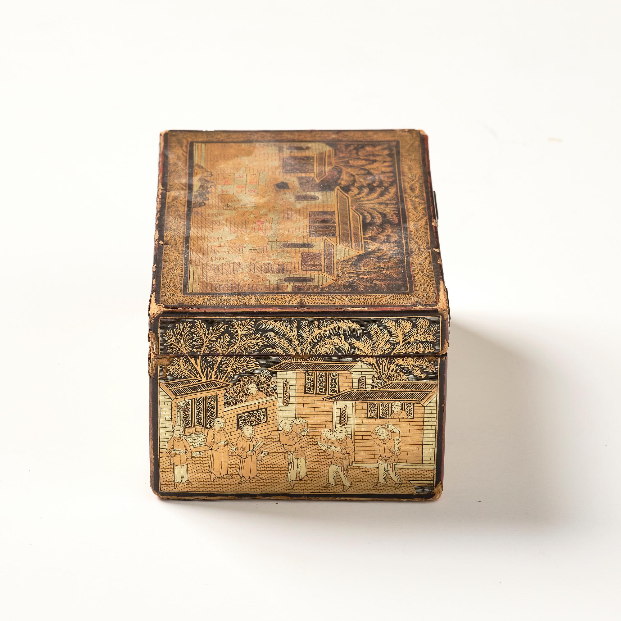 A lacquer tea box and a blanc de chine cup, Qing dynasty 18/19th century.