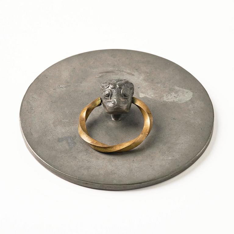 Firma Svenskt Tenn, a pewter hand mirror model A 1497 and a letter opener in the shape of an alligator, Stockholm, 1930s-40s.