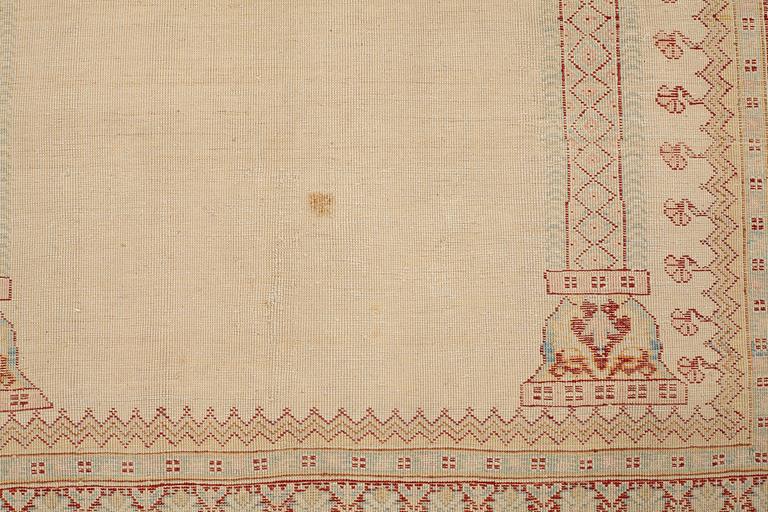 A RUG, an antique silk Tabriz, ca 165 x 118,5-111,5 cm.