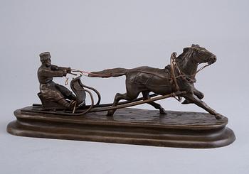 A SCULPTURE, Man in a horse sleigh.
