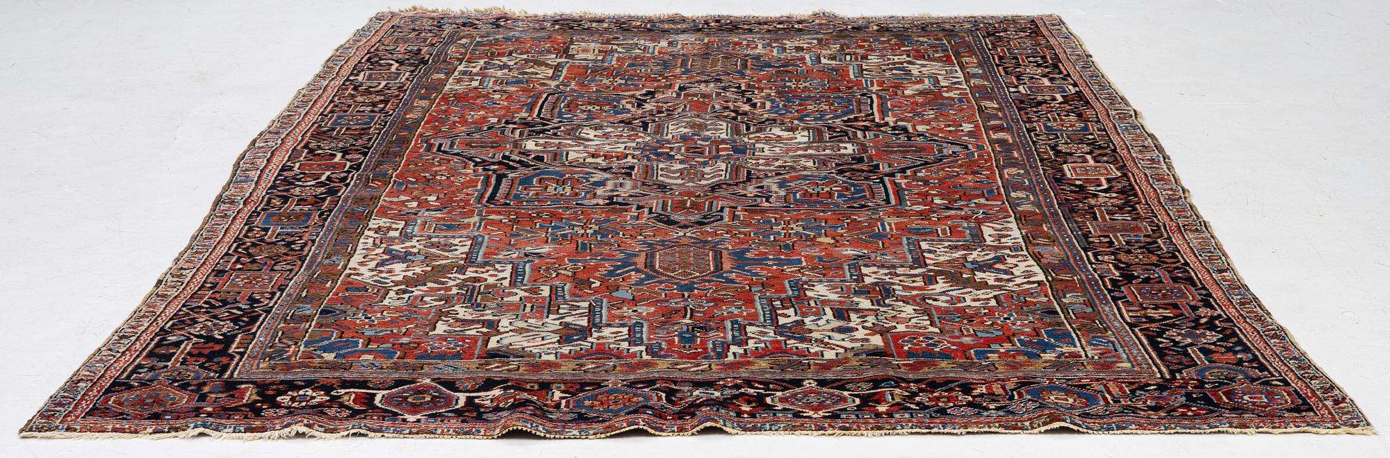 An antique Heriz carpet, west Persia, c. 333 x 238 cm.