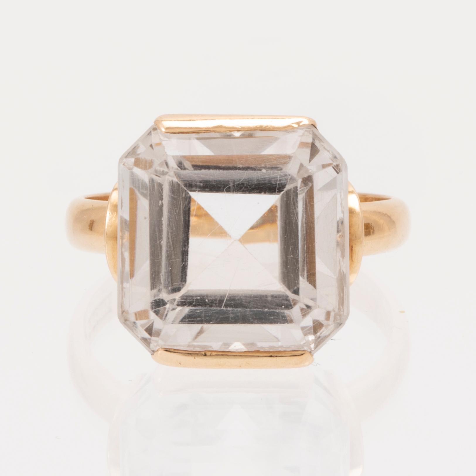 Ring och örhängen 18K guld samt fasettslipade bergskristaller.