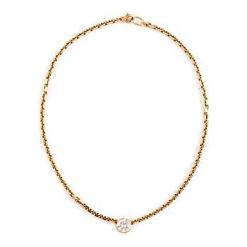 An 18K gold necklace set with an old-cut diamond.