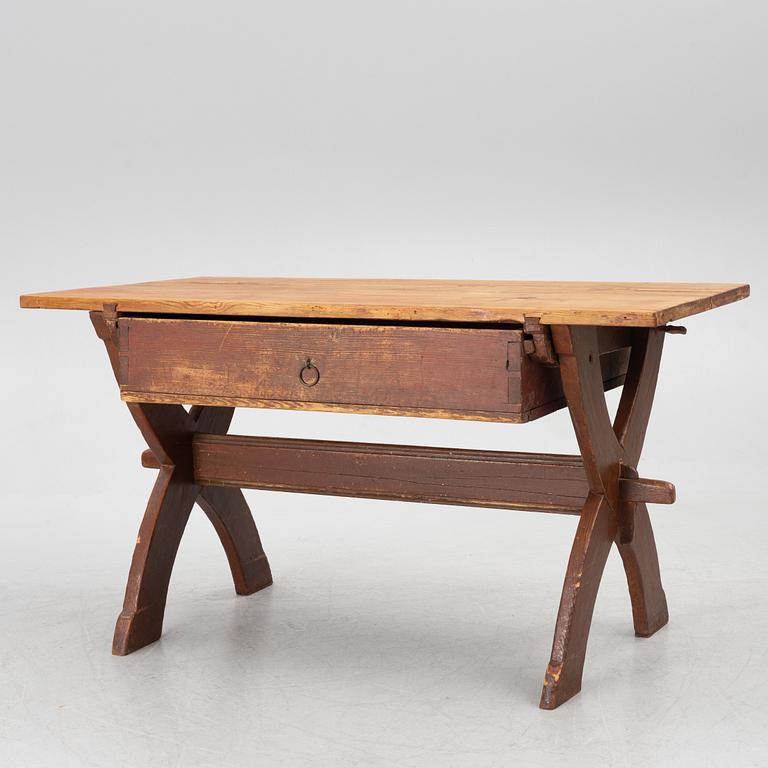 A Swedish folk-art trestle table from Dalarna, dated 1854.