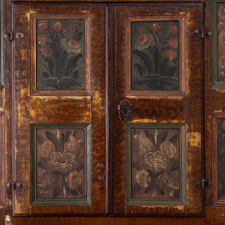 A corner cupboard, dated 1779.