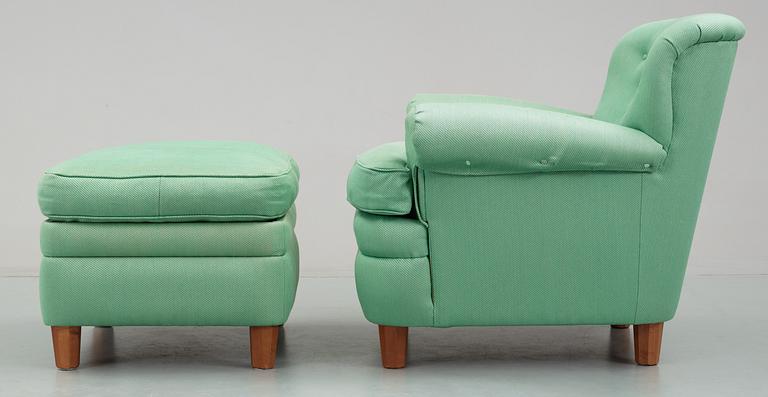 A Josef Frank armchair with ottoman, by Svenskt Tenn, model 568.