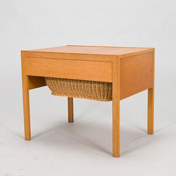 A mid-20th-century sewing table.