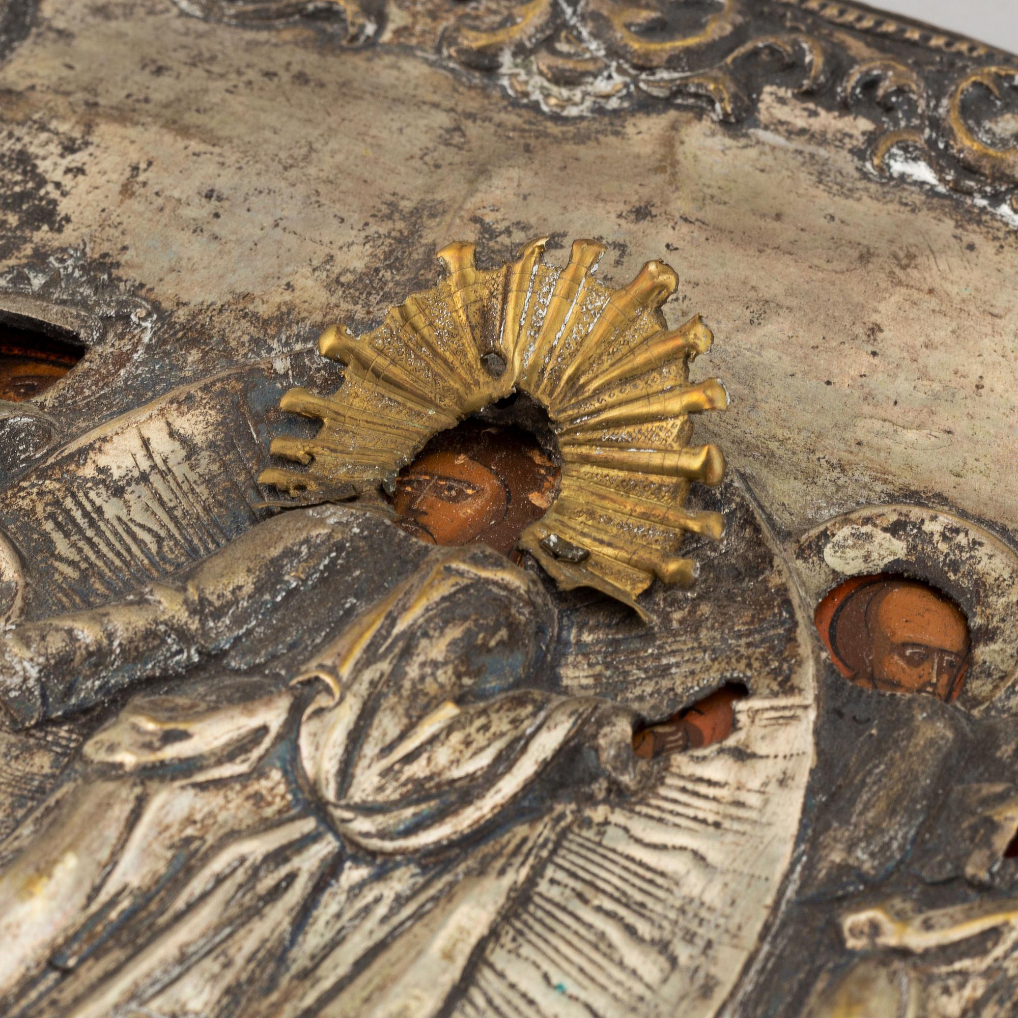 A russian icon with ochlad, rempera on panel, 19th Century.