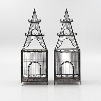 A pair of metal plant cages, contemporary.