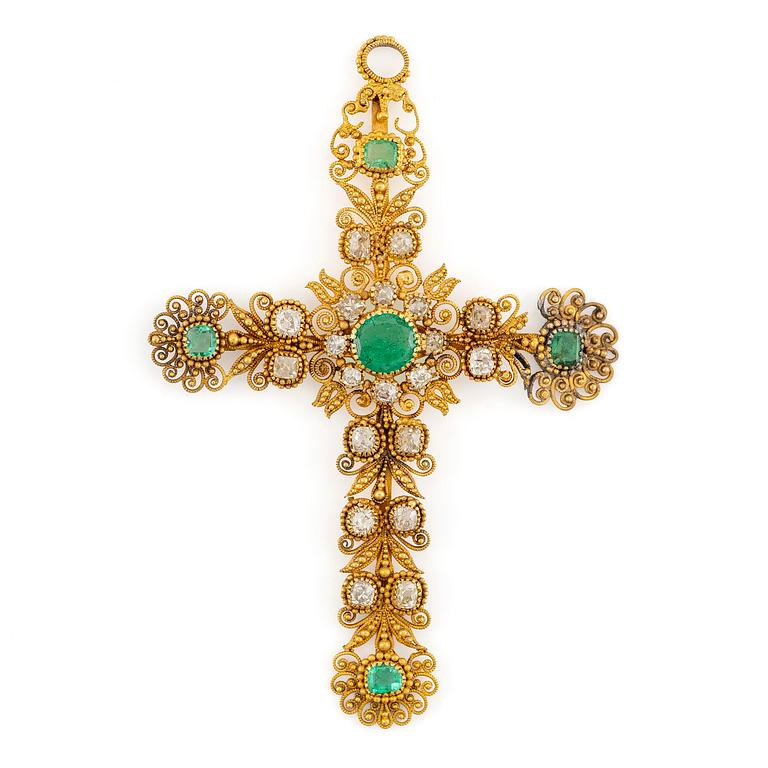 A cross in 14K gold set with faceted emeralds and old-cut diamonds, likely 18th century.