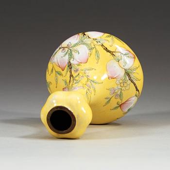 A yellow enamel on copper vase, Qing dynasty (1644-1912), with Qianlong four character mark.