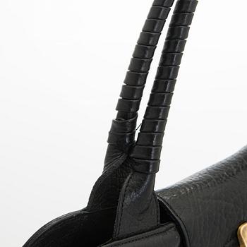 Max Mara, a leather handbag.