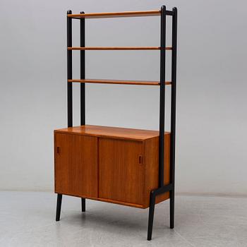 A second half of the 20th century teak veneered shelf.