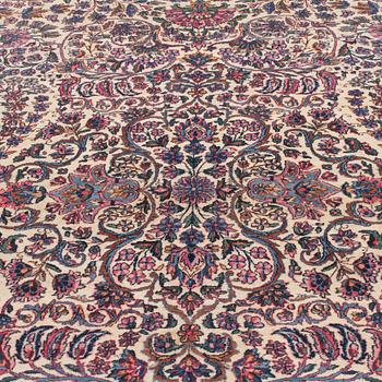 A CARPET, a semi-antique Kerman, ca 601 x 387 cm.