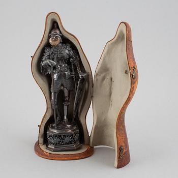 A silver knight figurine in case, pseudo marks.