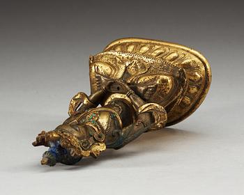 A partial-gilt bronze figure of Avalokiteshvara, Sino-Tibetan, 18th Century.