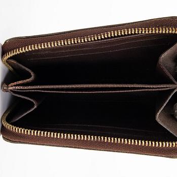 Louis Vuitton, a 'Zippy Coin Purse' wallet and an 'Inventeur' belt.