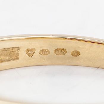 A 14K half eternity gold ring, with rubies.