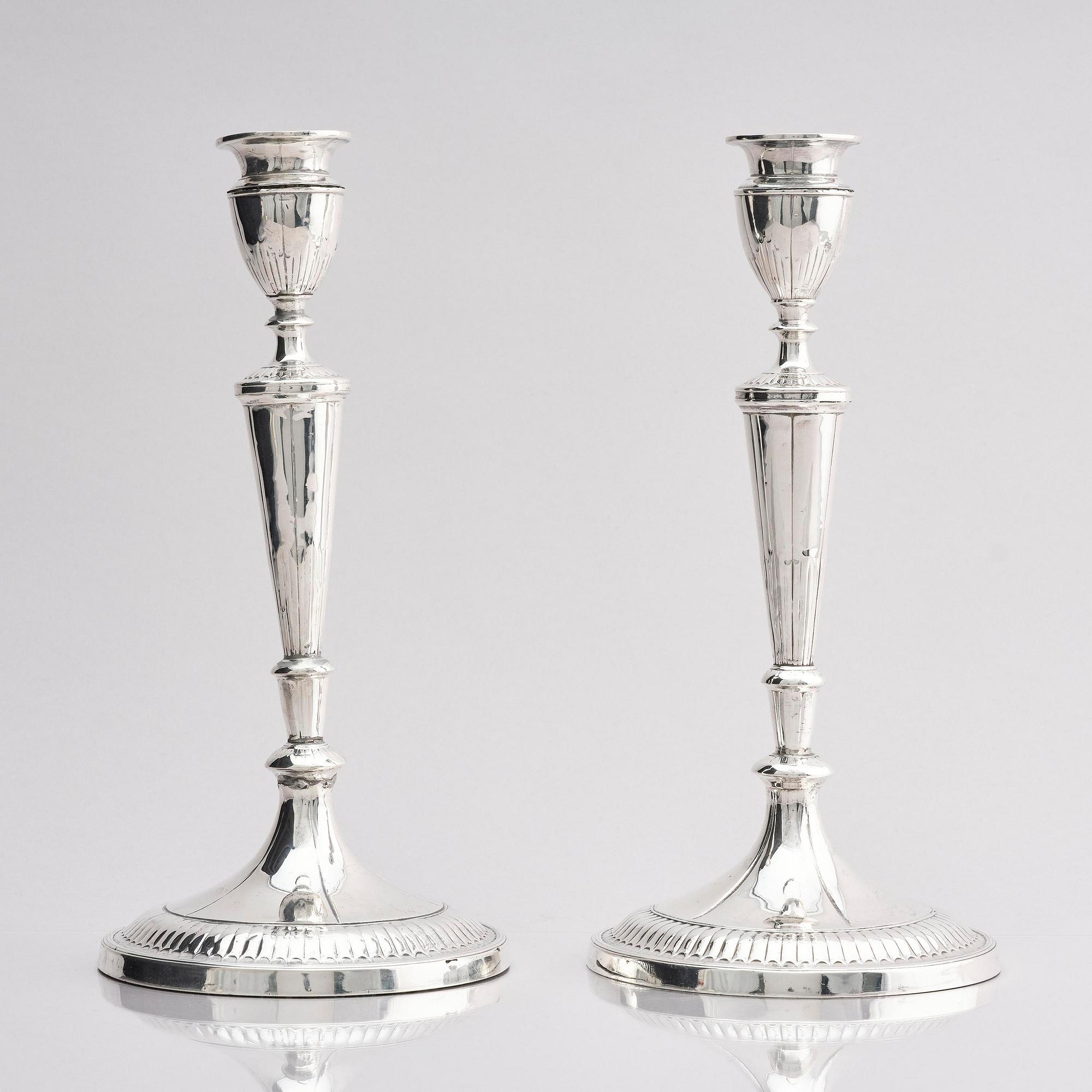 A pair of 18th century silver candlesticks, marks of John Parson & Co, Sheffield 1791.