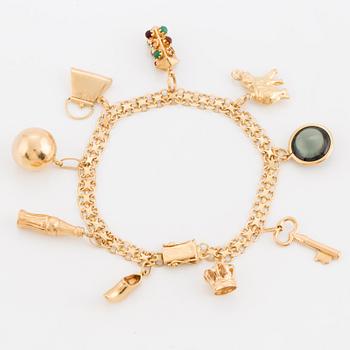 CHARM BRACELET, 18K gold with 9 charms.