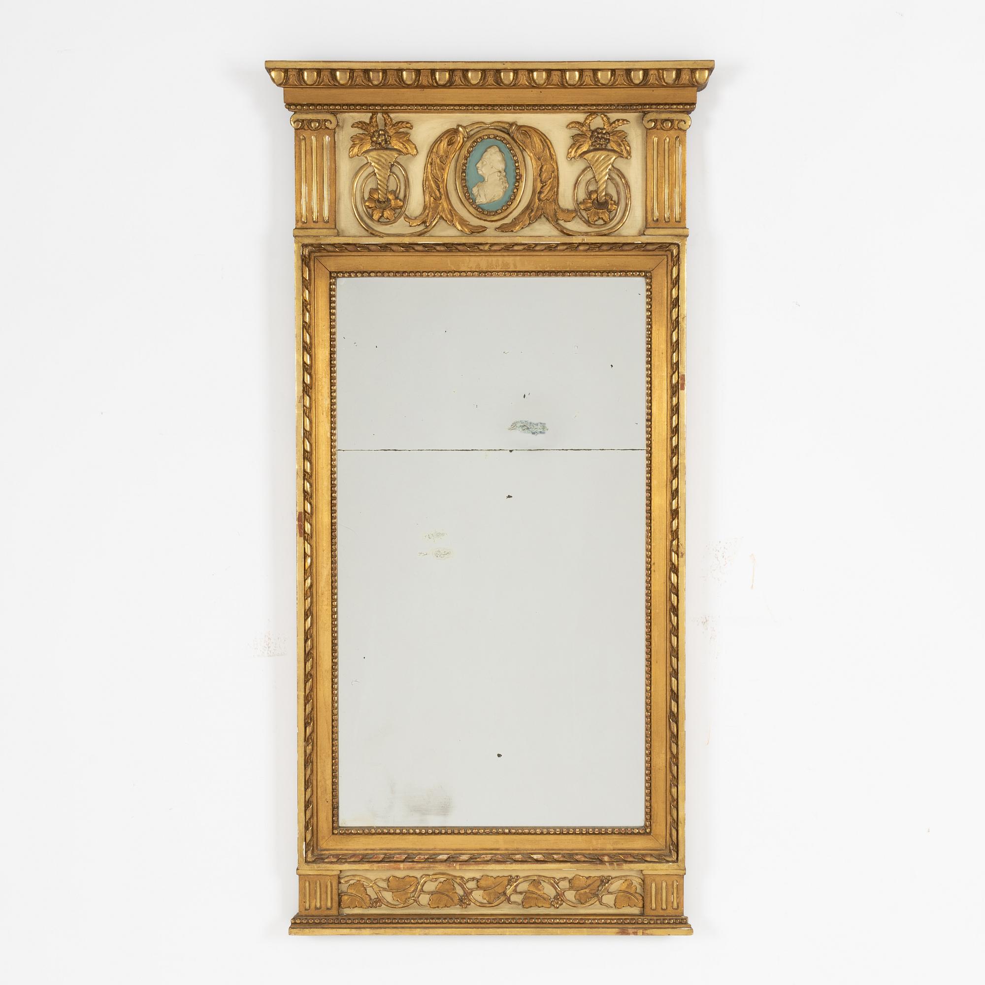 A Gustavian style mirror, circa 1900.