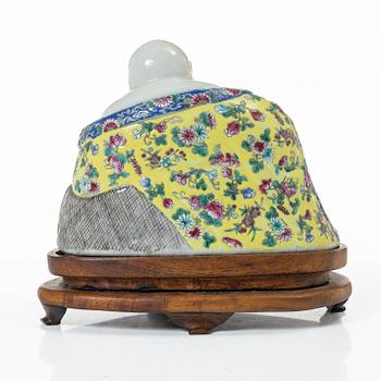 A Chinese famille rose porcelain figure of a Budai, around 1900.