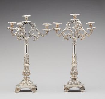 A pair of Swedish Empire silver candelabra, mark of Gustaf Mollenborg, Stockholm 1838.