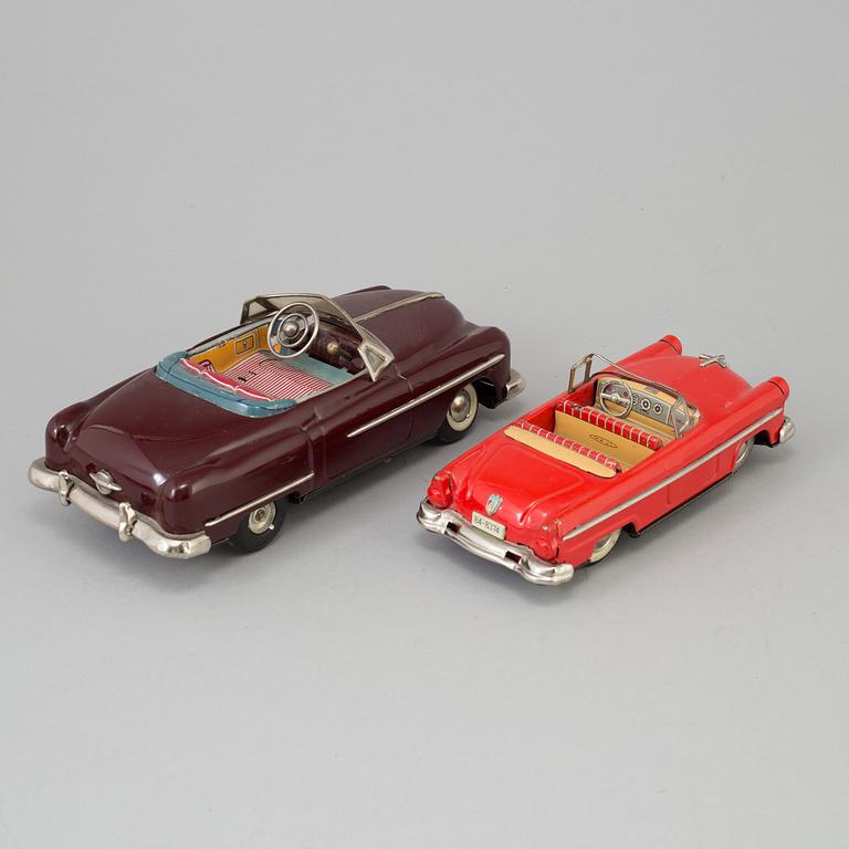 Four toy cars by Tekno and Haji, Germany and Japan.