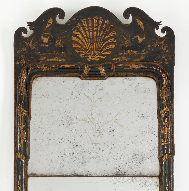 A Geroge II style mirror with 18th Century glass and later frame.