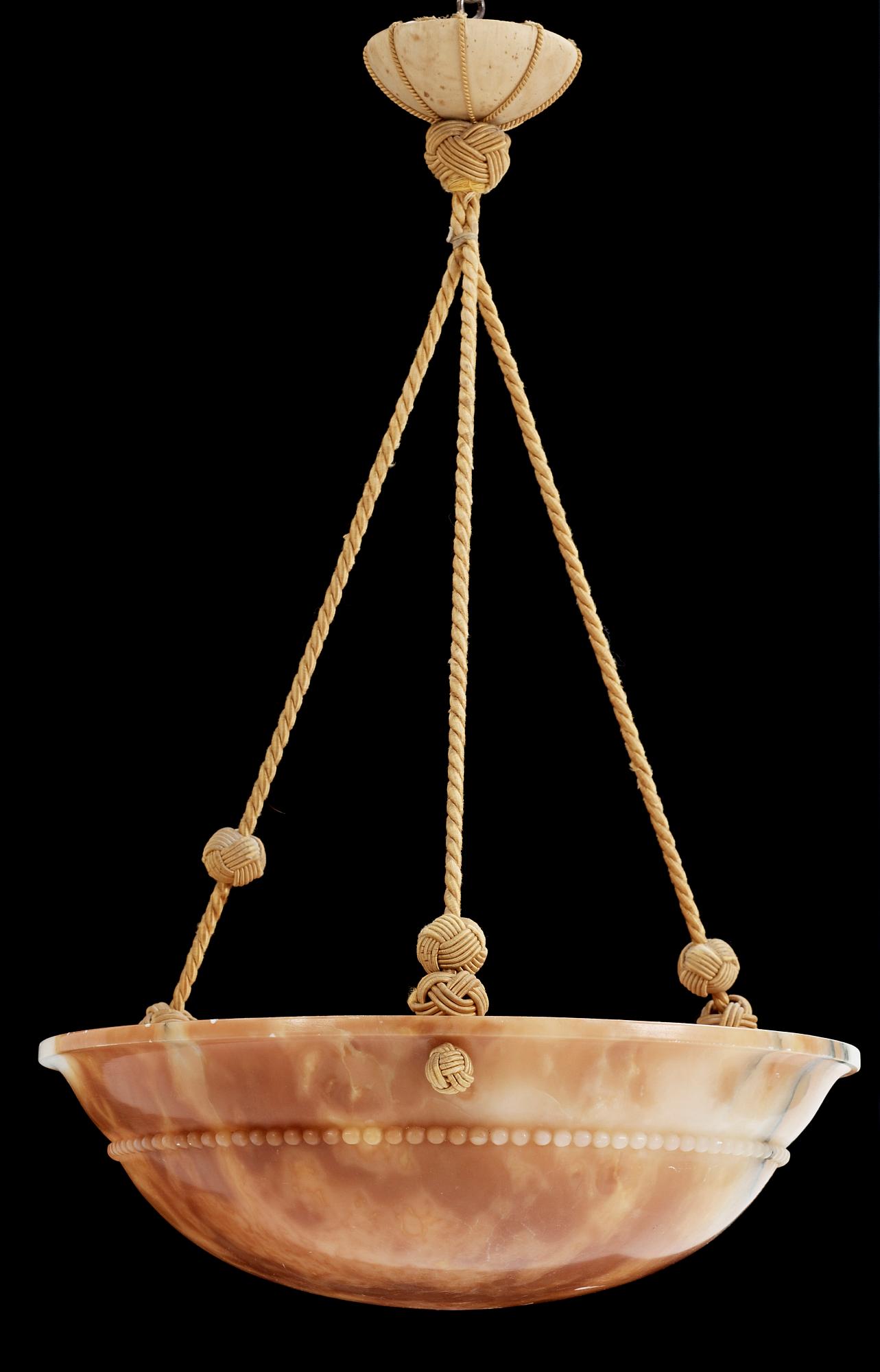TAKAMPEL, alabaster, 1910/20-tal. Höjd 70 cm.