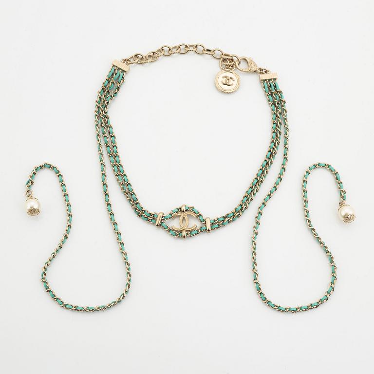 Chanel, a silver tone pearl and leather necklace.